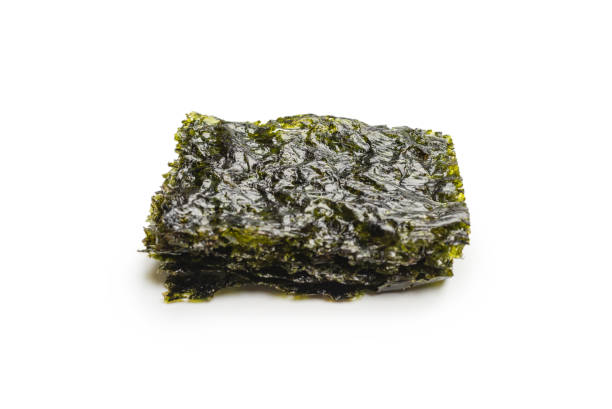 istock Tasty nori seaweed isolated on white. 1372010052