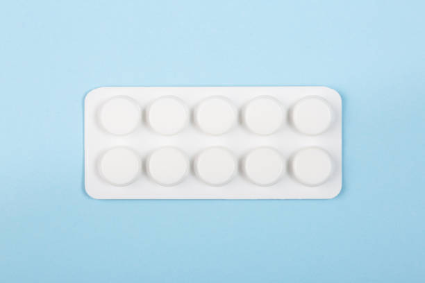 istock Pills in blister on blue background 1372010508