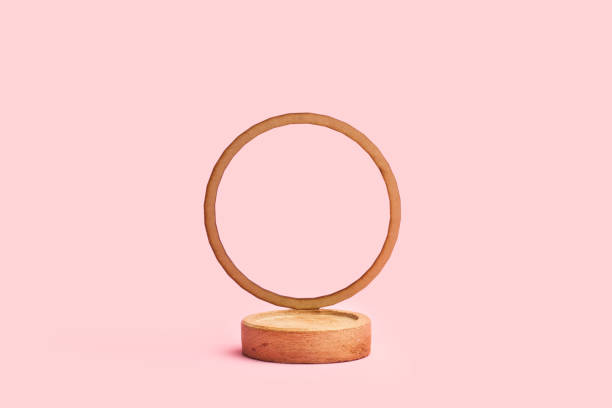 istock A round wooden base with a round ornament on a pink background 1372010538