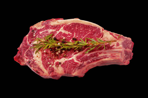 istock Raw beef top round roast on dark background with rosemary. 1372013759