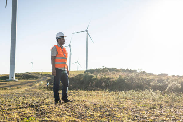 istock Portraits of an electrical engineer / technician in a wind farm park 1372014238