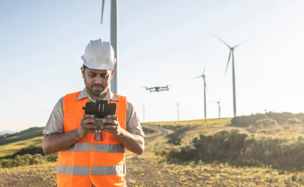 istock Portraits of electrical engineer/technician operating an inspection drone in wind farm park 1372015064
