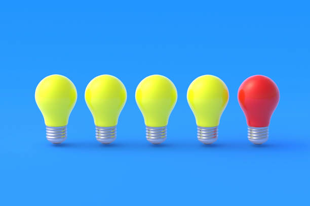 istock Yellow light bulbs and one of red color on blue background. 3d render 1372016805