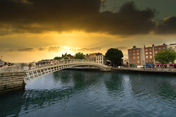 Sunset view of famous Ha' Penny Bridge in Dublin, Ireland