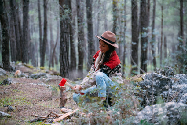 istock Woman Chopping Wood for Campfire 1372018019