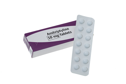 Generic Amitriptyline Hydrochloride pills which are used to treat symptoms of depression and also pain relief - white background