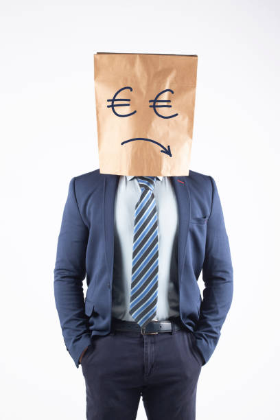 istock Businessman with paper bag on head 1372024143