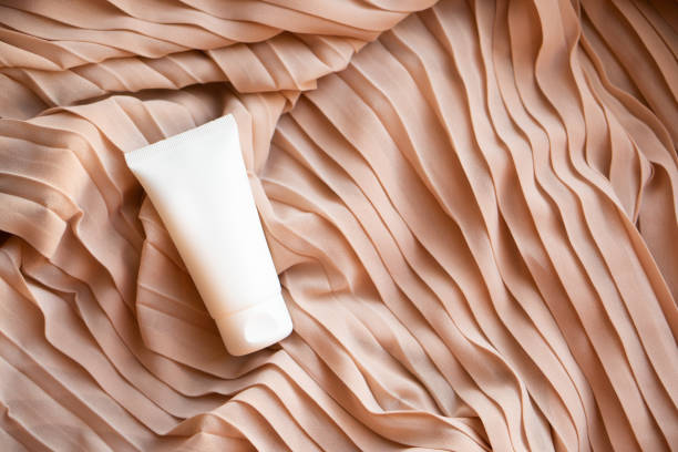 istock White cream tube mock-up on textile background 1372025971
