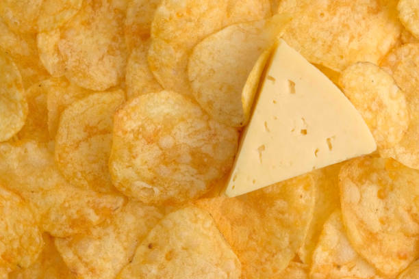 istock Background of Potato chips and cheese close up 1372026019