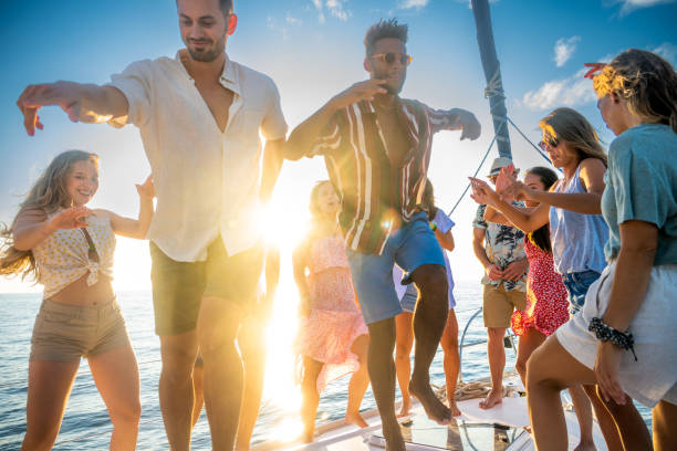 istock Young people enjoying party on yacht deck 1372026058