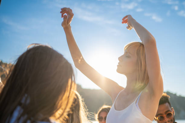 istock Sensual expression in attractive woman face while dancing at sunset 1372026069