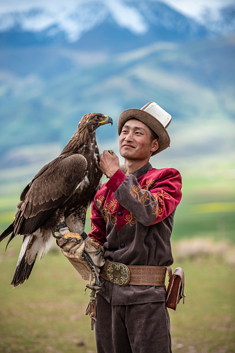 Traditional Kyrgyz Hunter Holding Eagle