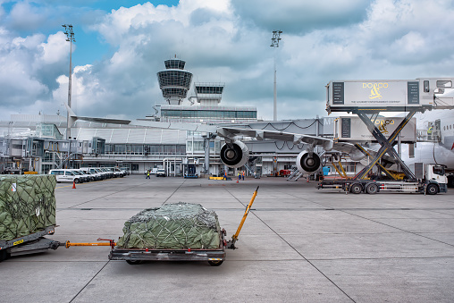 Loading of the aircraft jet at the Munich airport in summer: Munich, Germany - September 15, 2018
