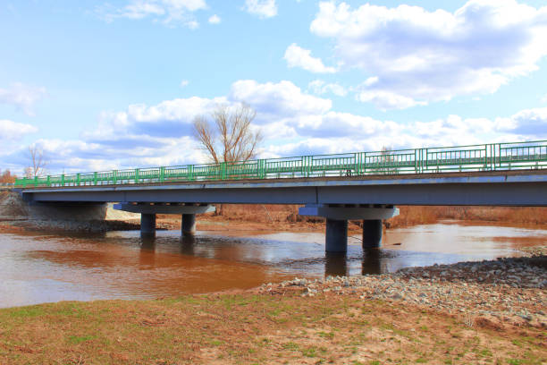 Reinforced concrete road bridge over the river. Close-up. Background.