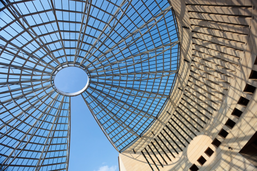 Futuristic glass-steel dome and its shadow of Mart museum in Rovereto in Italy