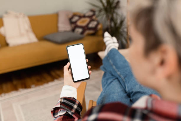 istock Young woman using a smartphone at home 1372031950
