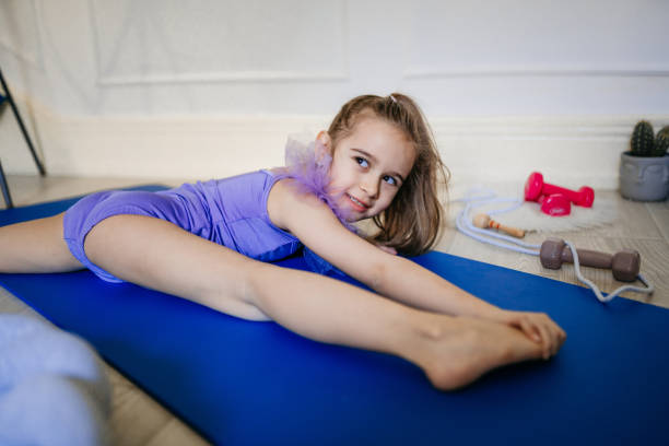 girl practicing ballet at home