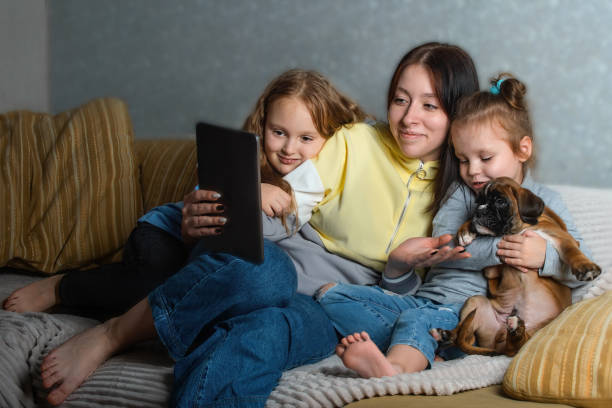 istock Family has fun at home with friendly online communication 1372034356