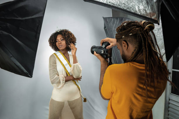 istock Photographer taking photo of model in studio 1372035155