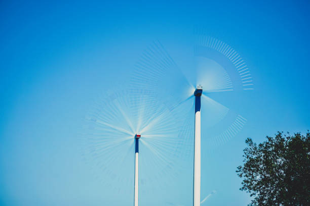 Wind turbines in a field in summer.