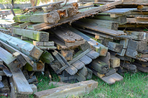 Pile of Rotted and Damaged Wooden Fence Materials. stock photo