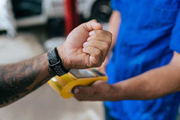 istock Customer paying contactless with smartwatch 1372046447