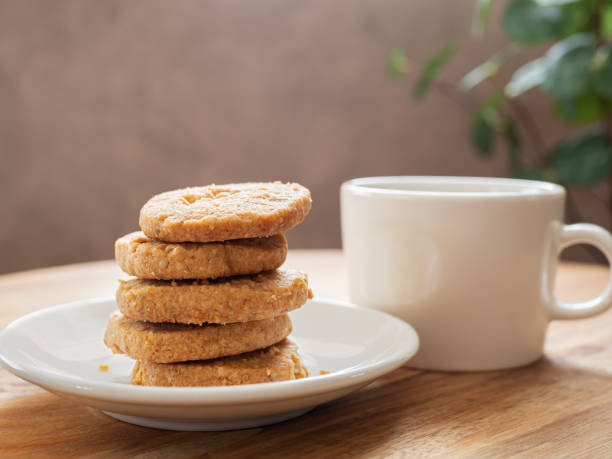 istock Mixed nuts cookies and cup of coffee 1372047274