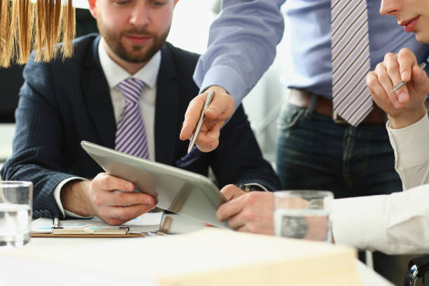 smart businesspeople making decisions in company, manager showing finance statistics to group - social housing audio imagens e fotografias de stock