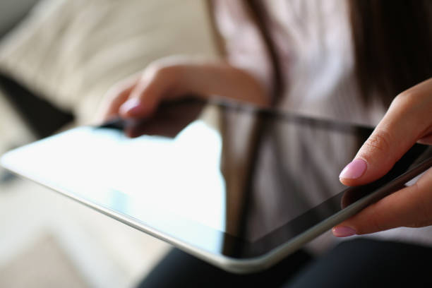 istock Female using digital tablet device for work or entertainment, black gadget screen 1372048610