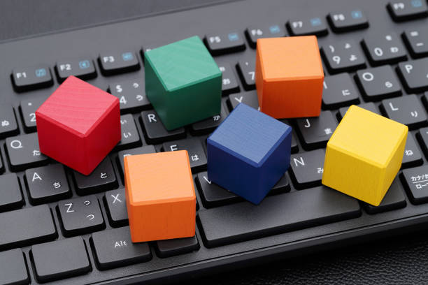 istock wooden toy blocks on computer keyboard 1372053096