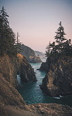 istock Sunset on natural bridges along the west coast of the Pacific Ocean, Oregon 1372053895