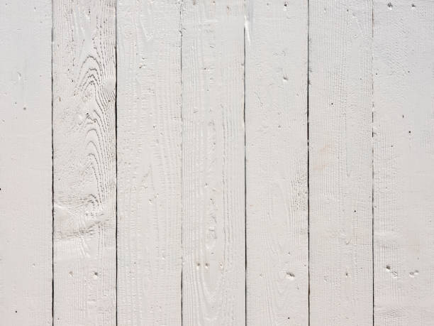 istock Old worn, weathered, white painted wood paneling background. 1372055794