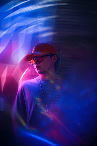 Asian male youth under neon lights