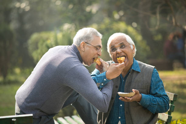 istock Two senior men having fun at park 1372061650