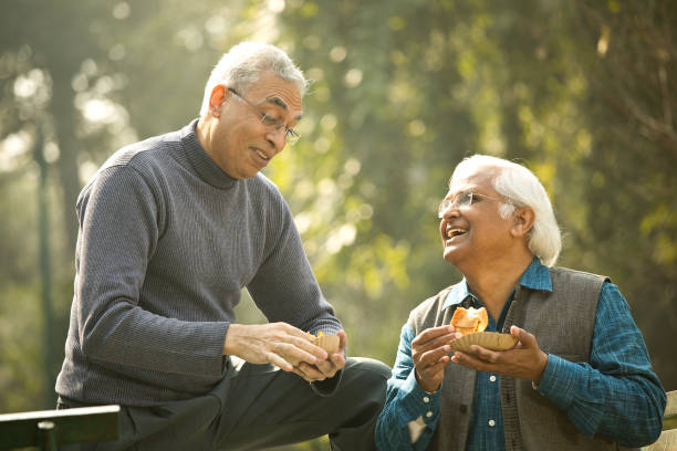 istock Two senior men having fun at park 1372061662
