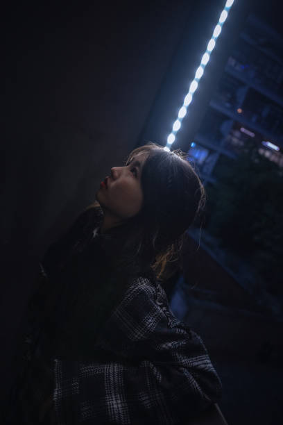 istock Asian girls leaning on the balcony 1372063392