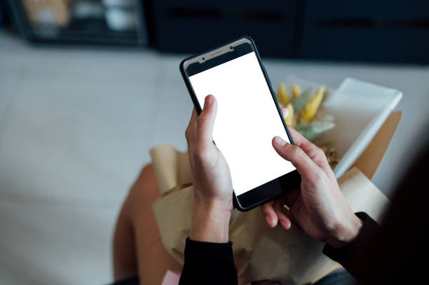 istock An Asian woman using mobile smart phone at home 1372064057