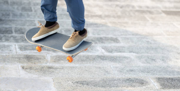 istock Asian skateboarder skateboarding in modern city 1372066184