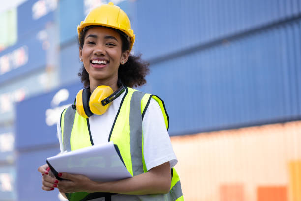istock Portrait happy foreman, engineer use clipboard at container ship 1372067783