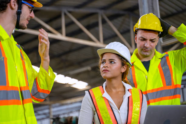istock Blue collar workers at factory. 1372068644