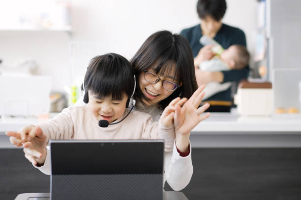 istock Asian female disturbed by children's telework 1372070455