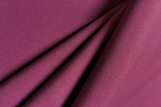 istock Pink crumpled or wavy fabric texture background. Abstract linen cloth soft waves. Gabardine wool fabric. Merino yarn. Smooth elegant luxury cloth texture. Concept for banner or advertisement 1372072242