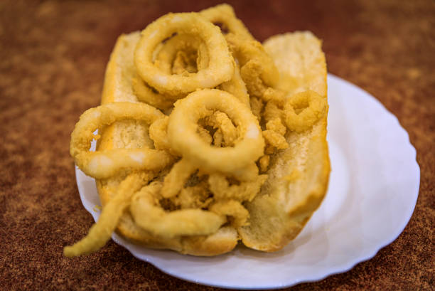 Traditional Spanish fried calamari sandwich served in a restaurant in Madrid, Spain