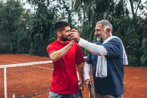 istock people playing tennis 1372075126