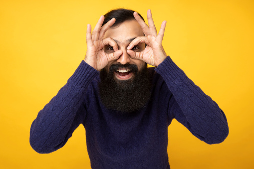 Portrait of young beard man isolated vivid background