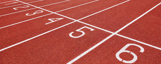 istock Red running track at stadium with lane numbers 1372076090