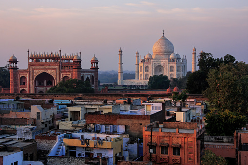 Rooftops of Taj Ganj neighborhood and Taj Mahal in Agra, India. Taj Mahal was build in 1632 by Emperor Shah Jahan as a memorial for his second wife Mumtaz Mahal.