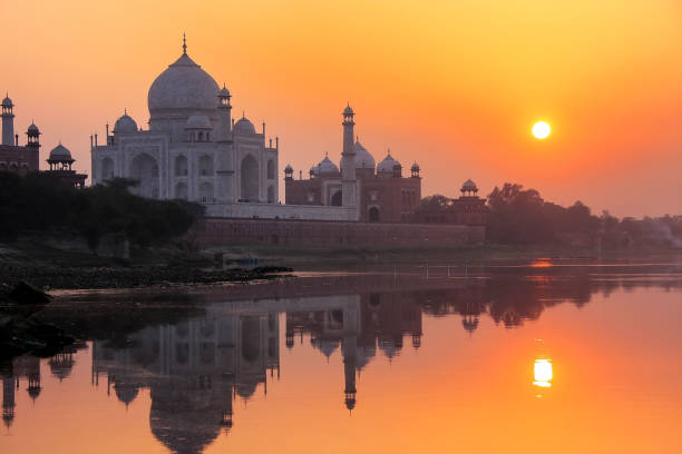 istock Taj Mahal reflected in Yamuna river at sunset in Agra, India 1372076985