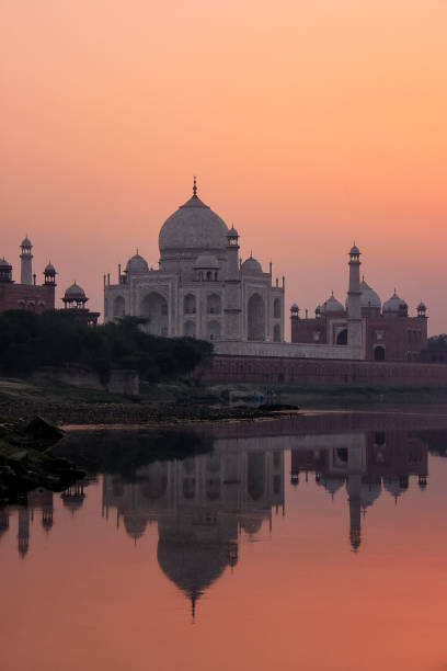 istock Taj Mahal reflected in Yamuna river at sunset in Agra, India 1372077119
