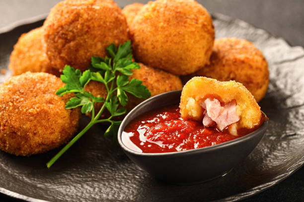istock POTATO CROQUETTES with ham and sauce close-up 1372077228